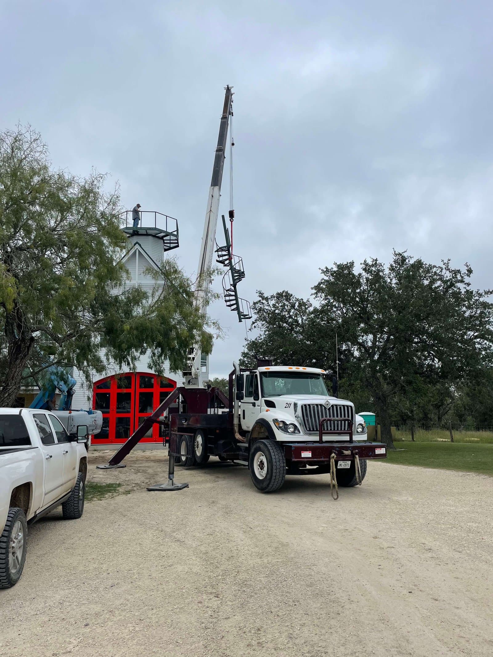 Tree Solutions truck-mounted crane on a job site