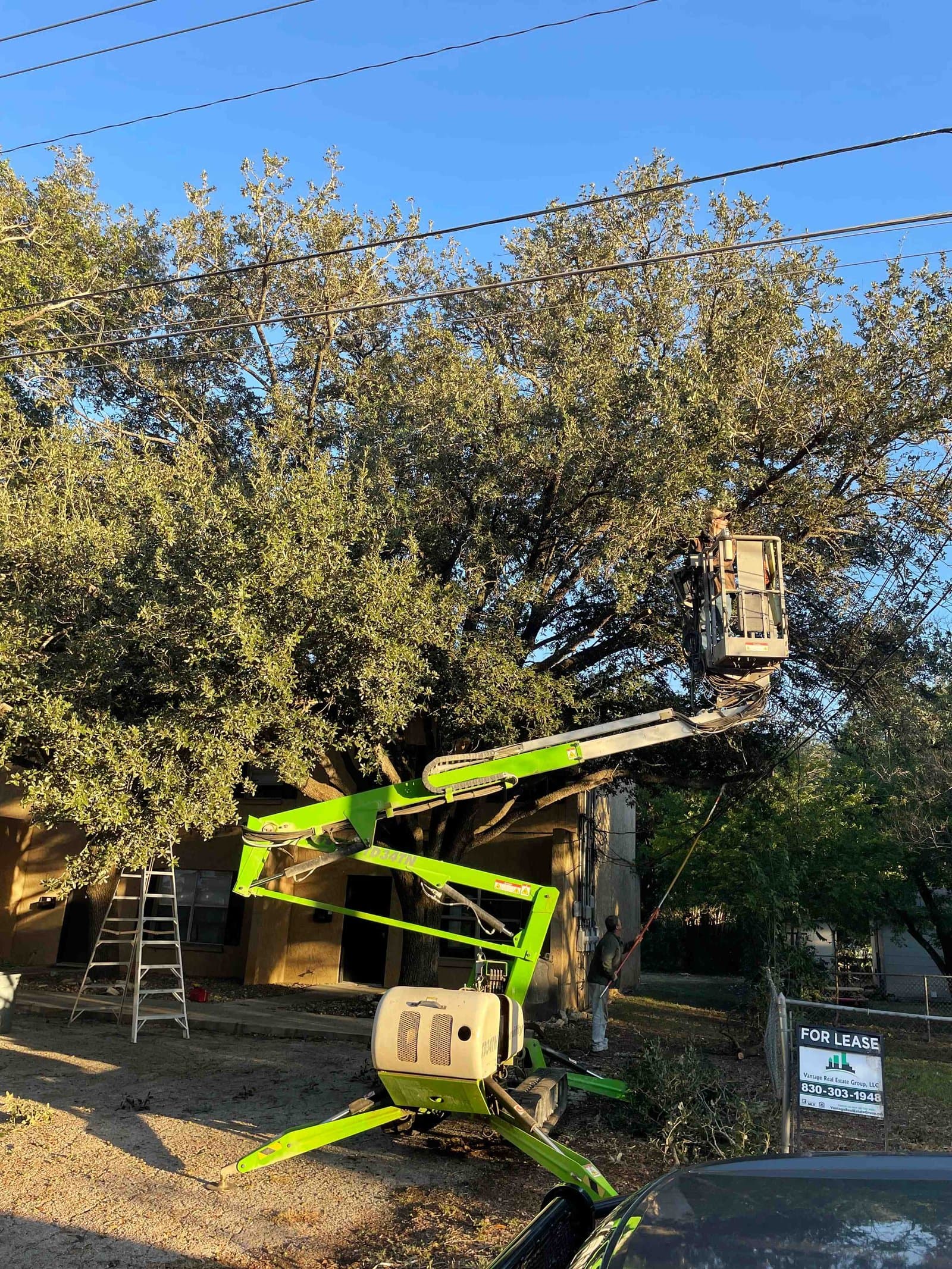 Tree Solutions man lift equipment used for tree work near Shiner, TX